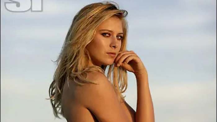 Maria Sharapova poses in a bikini and stares at the camera.